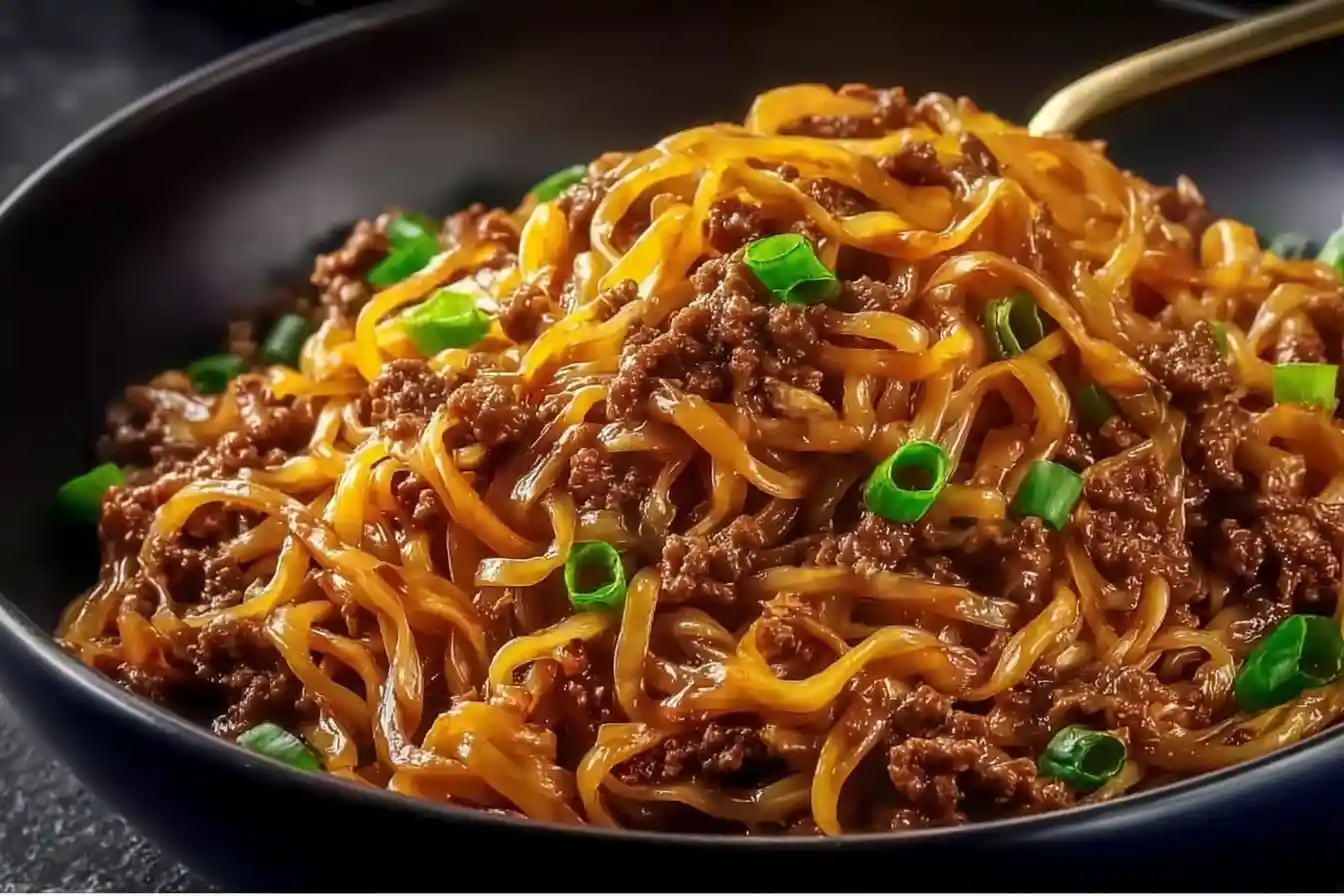 Delicious Mongolian Ground Beef Noodles served in a bowl with fresh vegetables