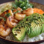 Shrimp & Avocado Bowl in a ceramic plate with lime