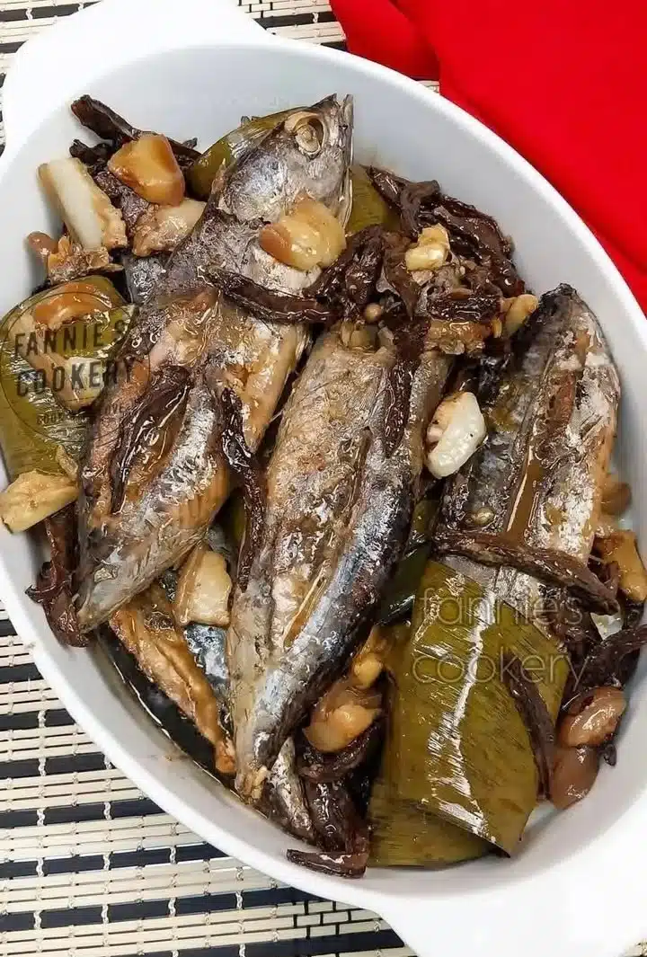 Delicious braised fish served with herbs and vegetables