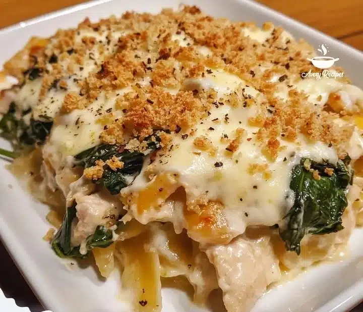 Spinach Chicken Casserole with Cream Cheese and Mozzarella on a wooden table