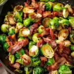 Brussels sprouts cooked with crispy bacon on a plate