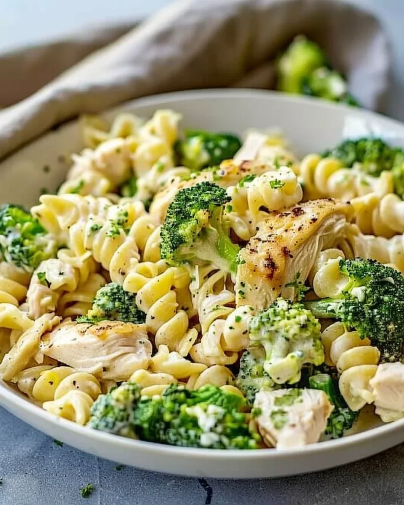 Creamy rotisserie chicken broccoli pasta dish served in a bowl