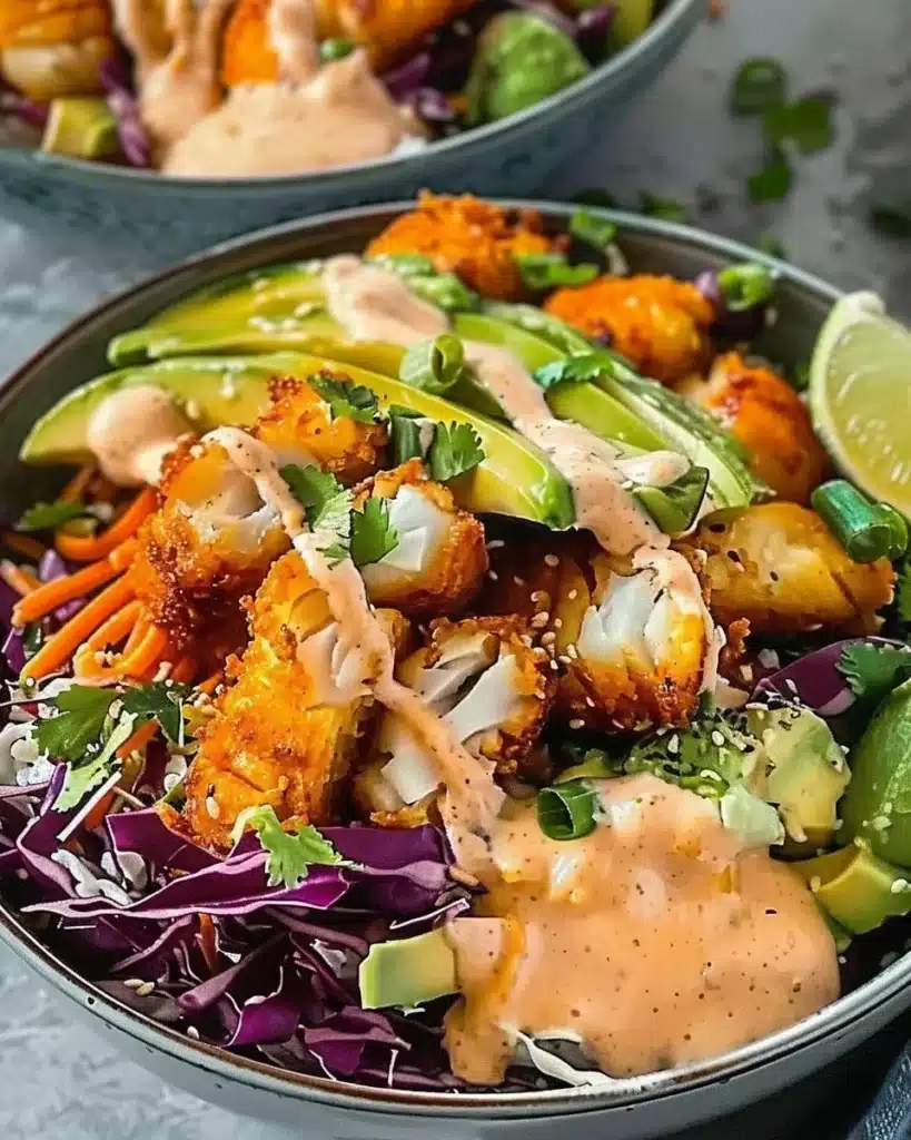 Crispy fish taco bowl topped with vibrant toppings and served in a colorful dish