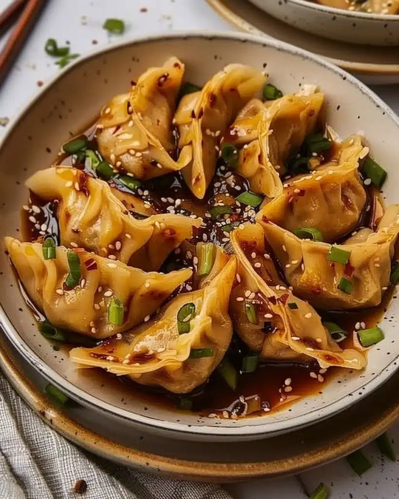 Delicious crispy vegan dumplings served with dipping sauce.