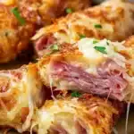 Delicious Keto Crispy Reuben Roll-Ups served on a plate with dipping sauce.