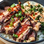 Korean BBQ steak rice bowl with marinated steak and vegetables over rice.