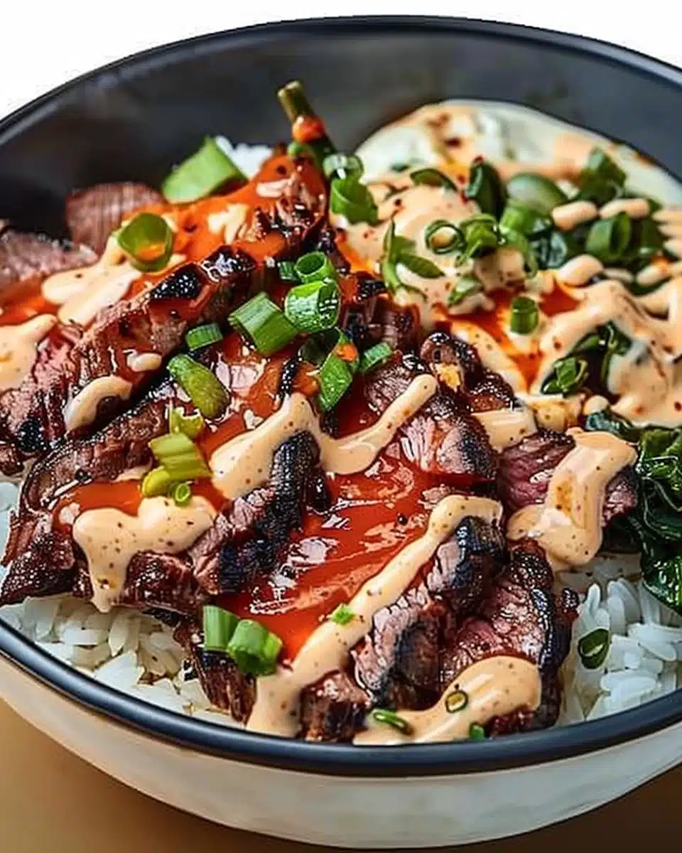 Korean BBQ steak rice bowl with marinated steak and vegetables over rice.