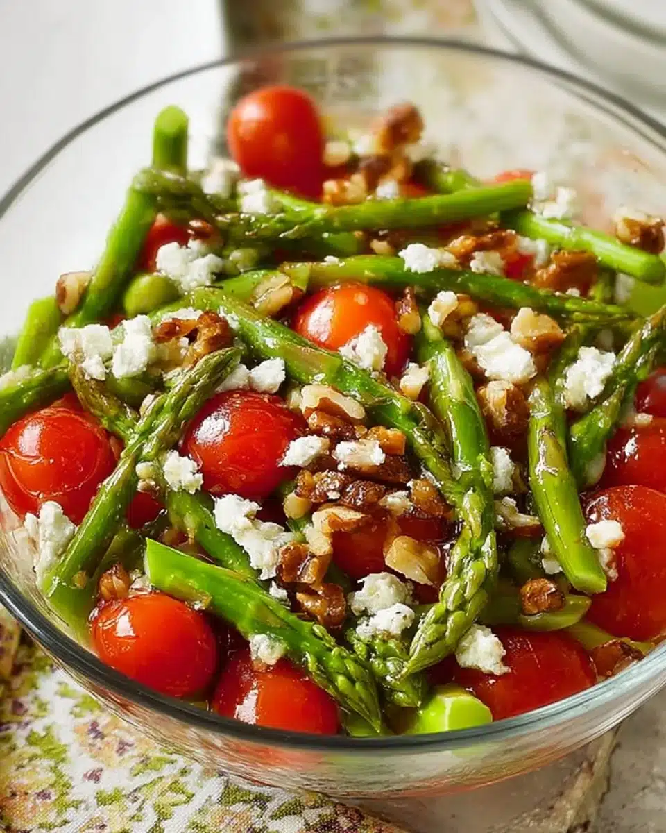 Asparagus tomato feta salad with balsamic vinaigrette on a plate