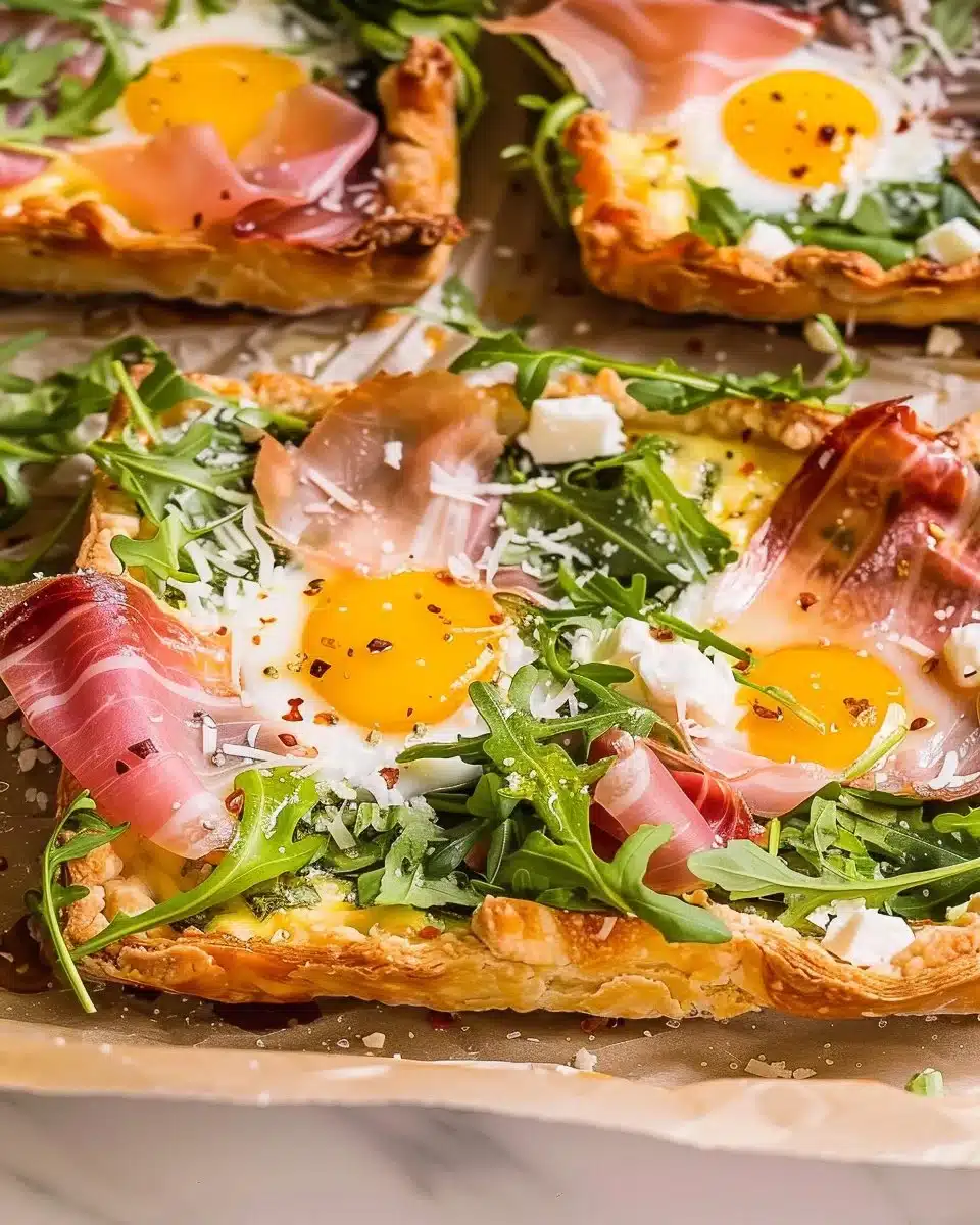 Baked prosciutto and egg breakfast tart served on a wooden platter.