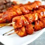 BBQ chicken kebabs skewers grilled to perfection with colorful vegetables