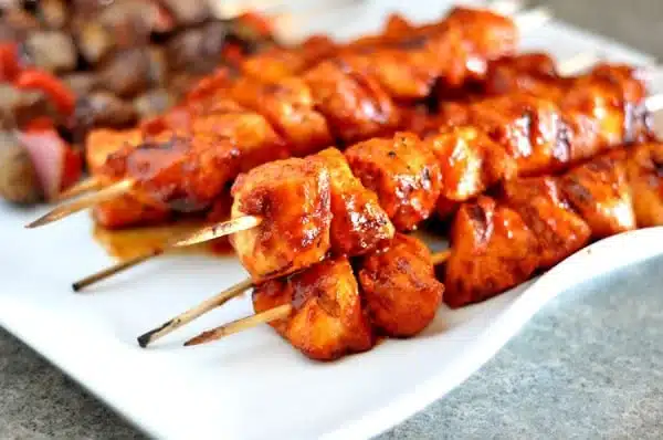 BBQ chicken kebabs skewers grilled to perfection with colorful vegetables