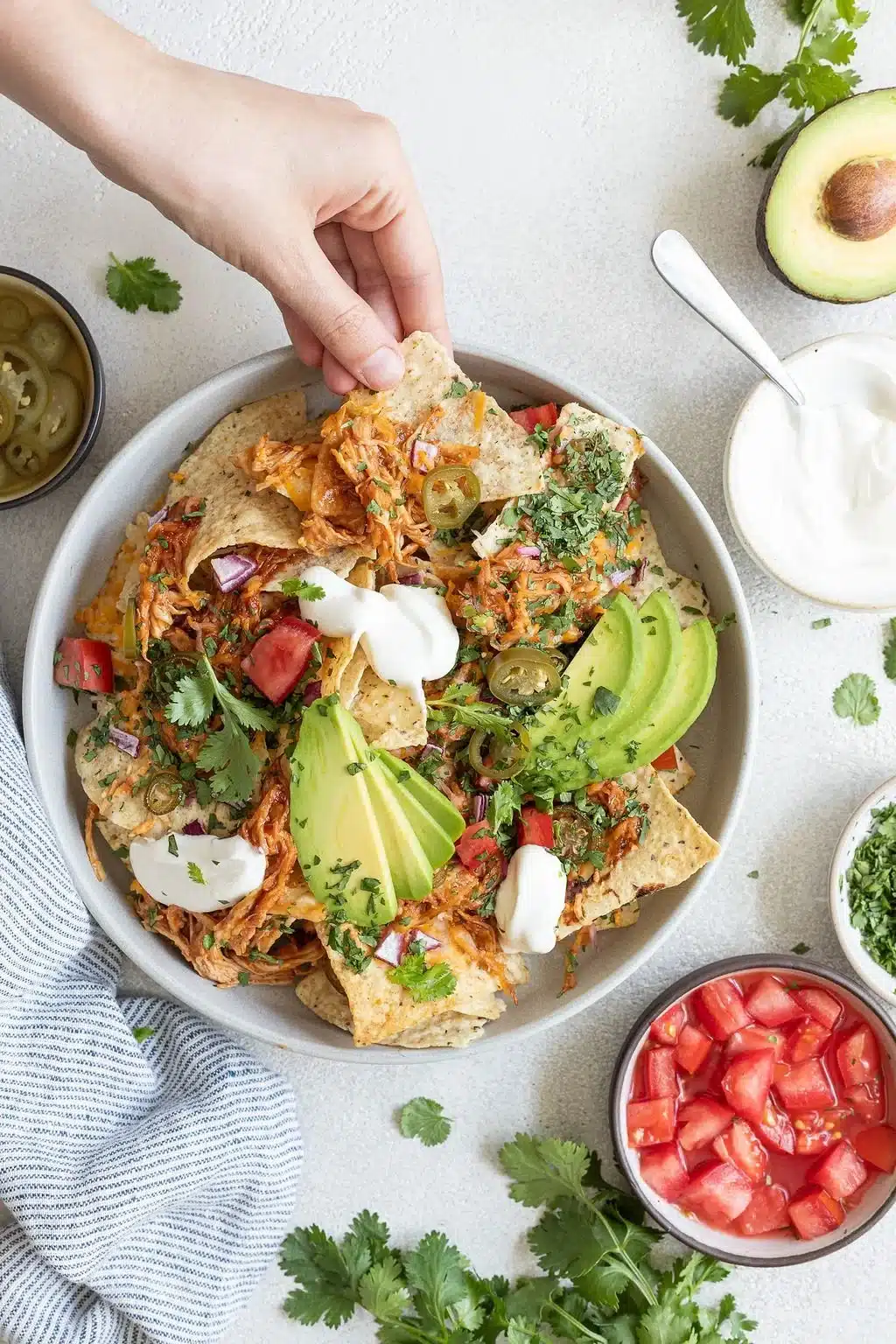 Delicious BBQ chicken nachos loaded with cheese and toppings