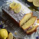 Deliciously moist Coconut Lemon Loaf Cake topped with lemon glaze.