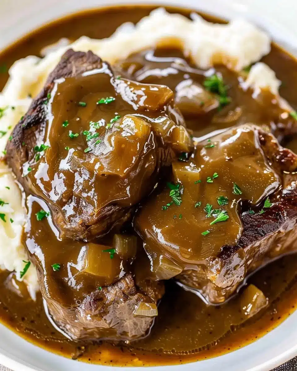Crock Pot cube steak simmering in rich gravy for a delicious meal.