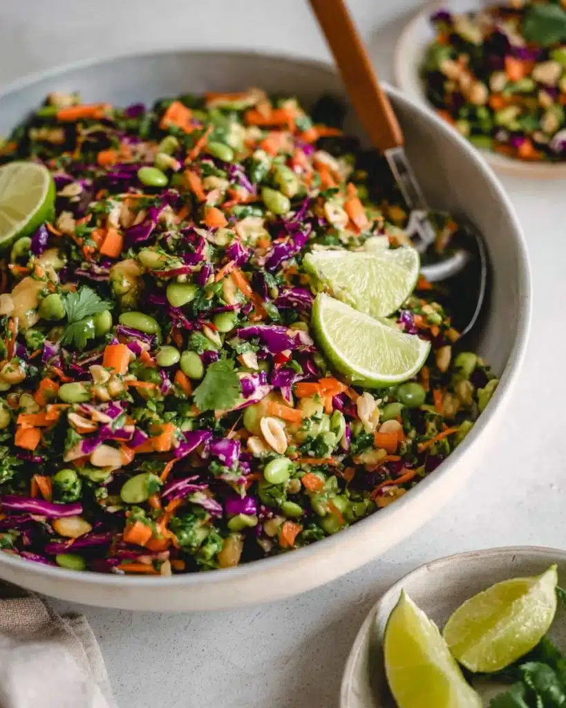 Bowl of Edamame Crunch Salad with Peanut Dressing and fresh vegetables.