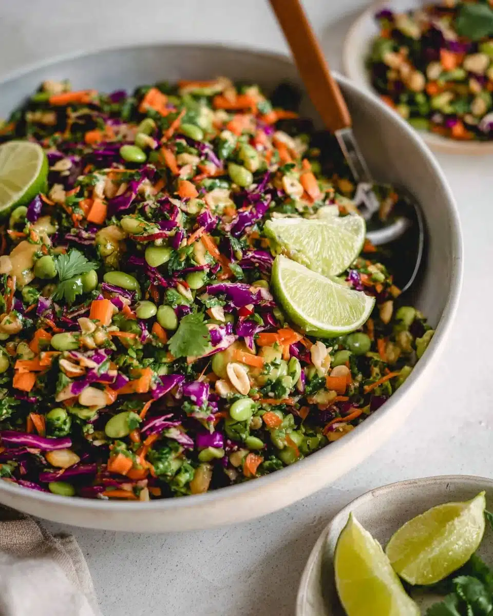 Bowl of Edamame Crunch Salad with Peanut Dressing and fresh vegetables.