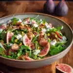 Fresh fig and goat cheese salad with greens and nuts