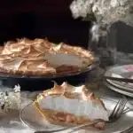 A delicious rhubarb tart topped with meringue and fresh rhubarb slices.