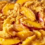 Baked easy peach crisp topped with a golden oat crumble