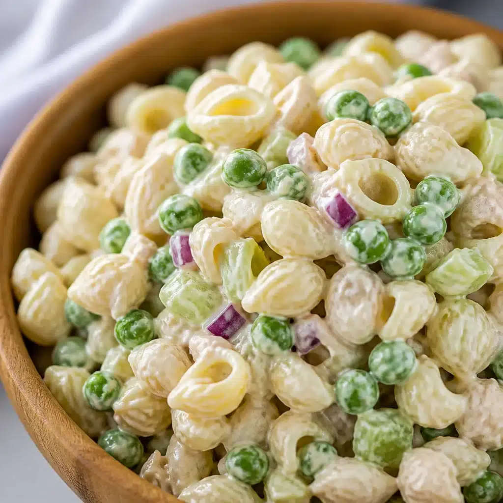 Classic Tuna Pasta Salad with shell noodles, celery, peas, and creamy dressing