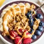 Delicious homemade acai bowl topped with fresh fruits and granola.