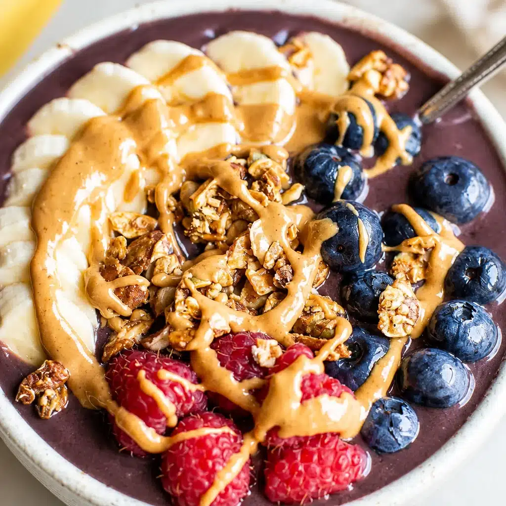Delicious homemade acai bowl topped with fresh fruits and granola.
