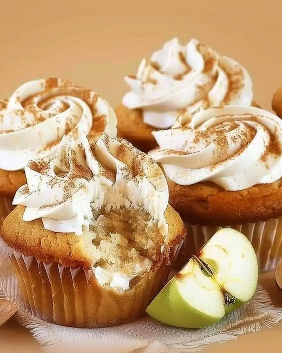 Apple pie cupcakes with cinnamon frosting and apple garnish