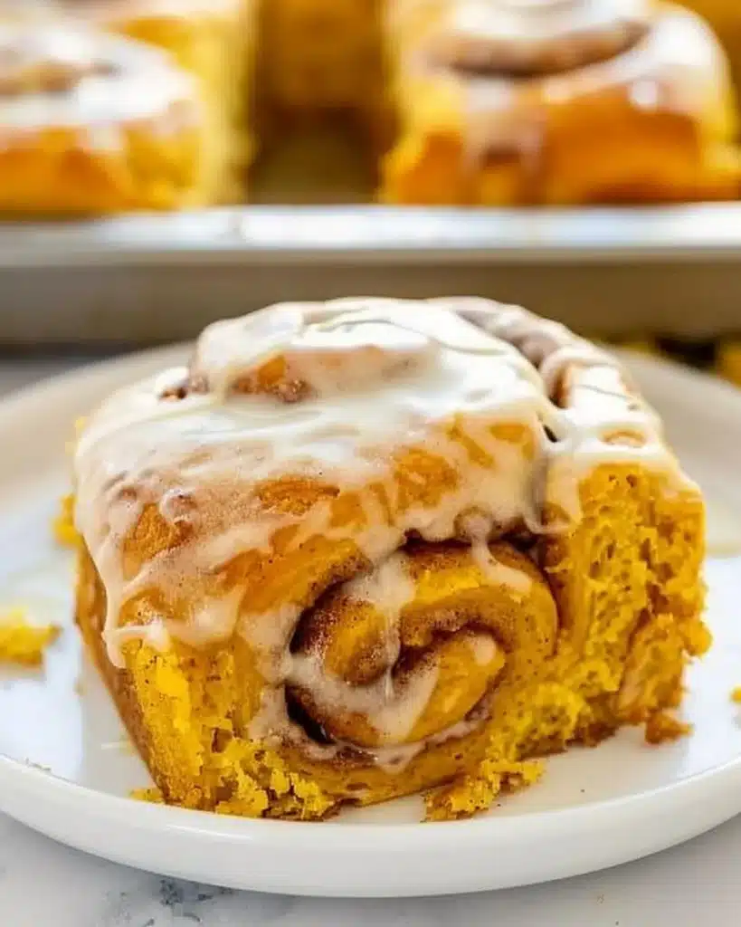 Delicious pumpkin cinnamon rolls topped with cream cheese icing