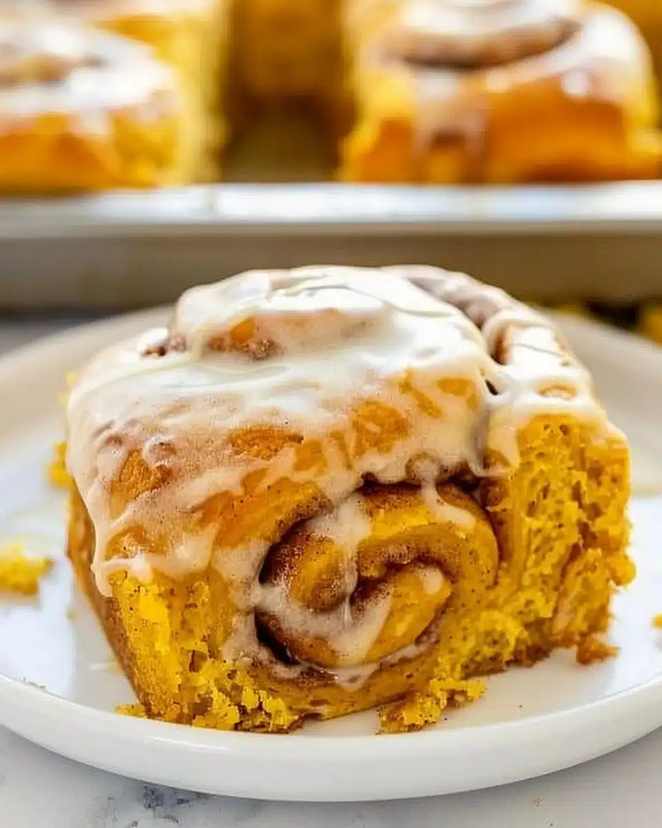 Delicious pumpkin cinnamon rolls topped with cream cheese icing