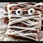 Mummy Halloween Brownies decorated with icing and candy eyes for Halloween